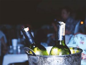 Chilling white wines in a bucket of ice