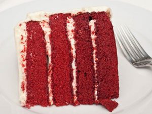 A photograph of scrumptious piece of Red Velvet Cake